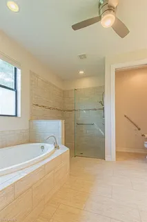 a bathroom with a bathtub and shower