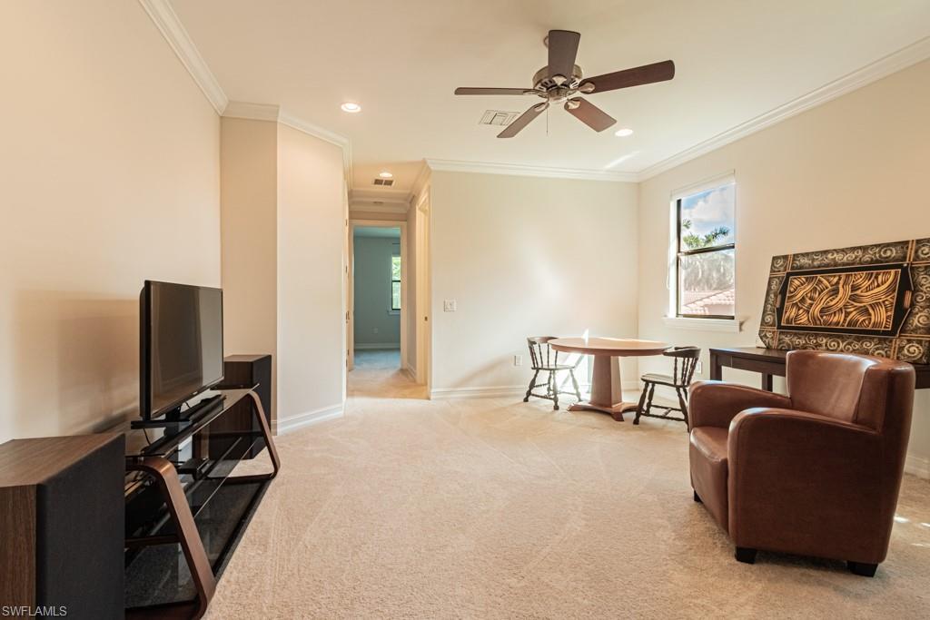 7761 Bucks Run Drive Naples, FL 34120 - Photo 29 of 50 a bedroom with furniture and a ceiling fan