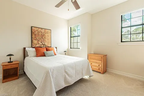 a bedroom with bed and a window