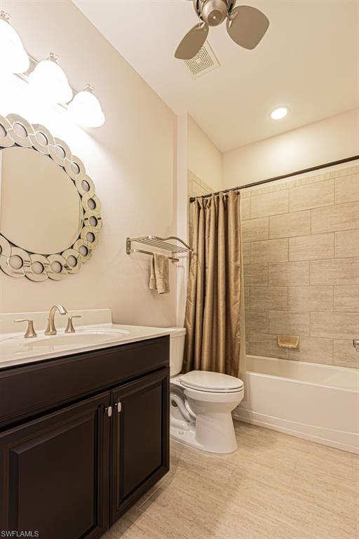 7761 Bucks Run Drive Naples, FL 34120 - Photo 35 of 50 a bathroom with a double vanity sink mirror and toilet