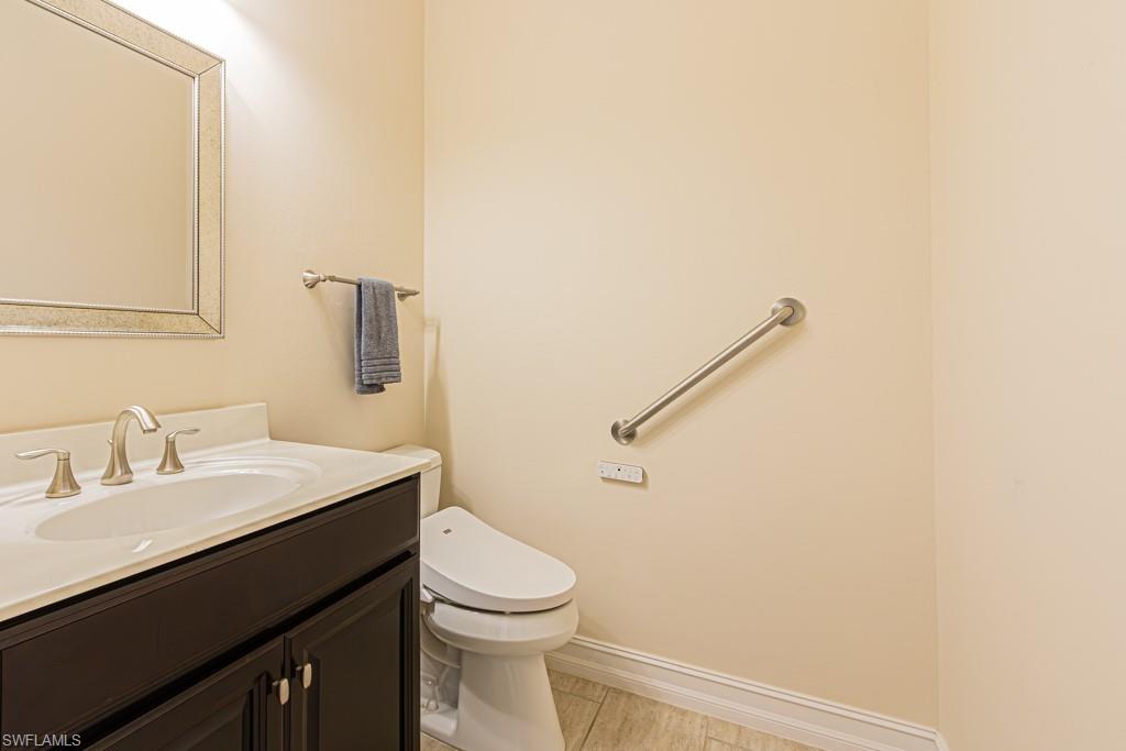 7761 Bucks Run Drive Naples, FL 34120 - Photo 40 of 50 a bathroom with a sink a toilet and shower