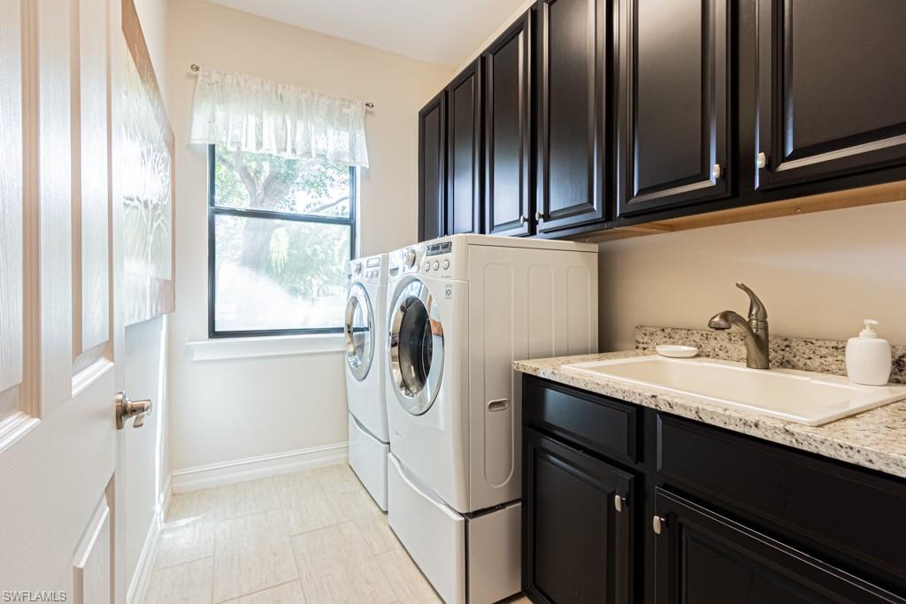 7761 Bucks Run Drive Naples, FL 34120 - Photo 42 of 50 a utility room with dryer and washer
