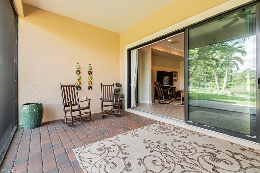 7761 Bucks Run Drive Naples, FL 34120 - Photo 44 of 50 a hallway with a bed and a window