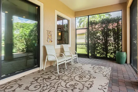 a living room with a couch and a window