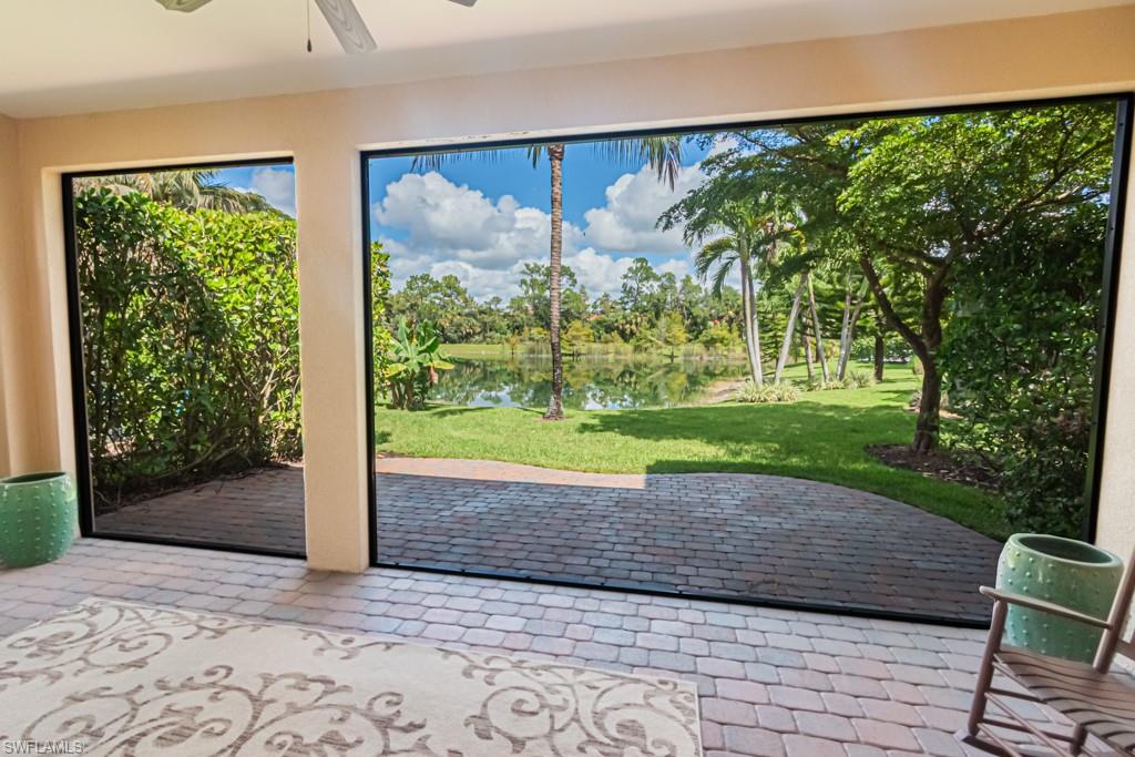 7761 Bucks Run Drive Naples, FL 34120 - Photo 46 of 50 a view of a garden with a chair
