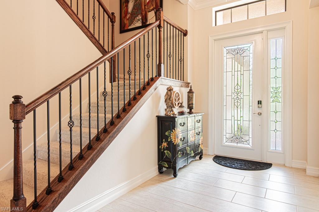 7761 Bucks Run Drive Naples, FL 34120 - Photo 7 of 50 a view of entryway and interior of a house