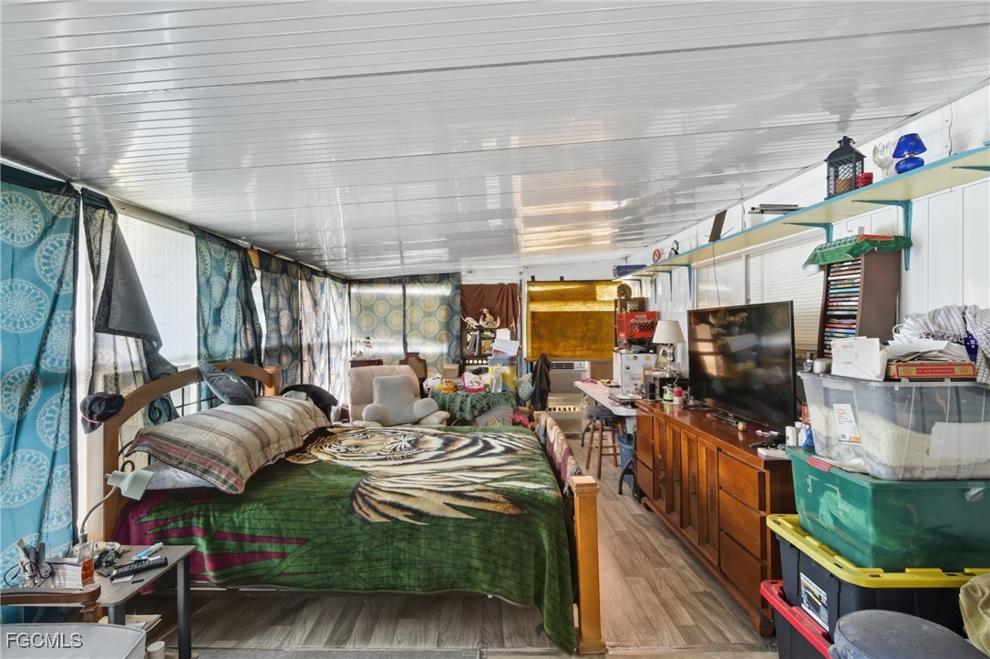 136 Lexington Avenue Fort Myers, FL 33908 - Photo 16 of 31 a living room with furniture and a flat screen tv