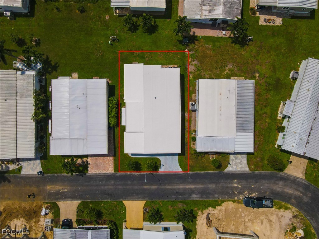 136 Lexington Avenue Fort Myers, FL 33908 - Photo 25 of 31 an aerial view of a house with a swimming pool