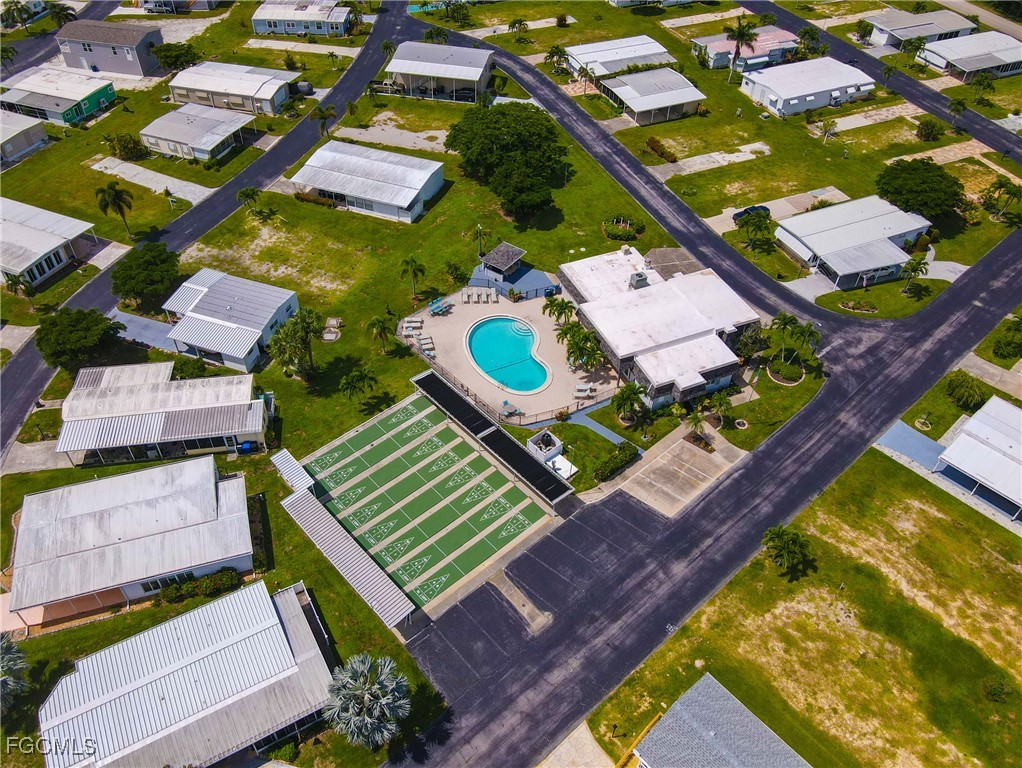 136 Lexington Avenue Fort Myers, FL 33908 - Photo 27 of 31 an aerial view of a house with a garden and swimming pool