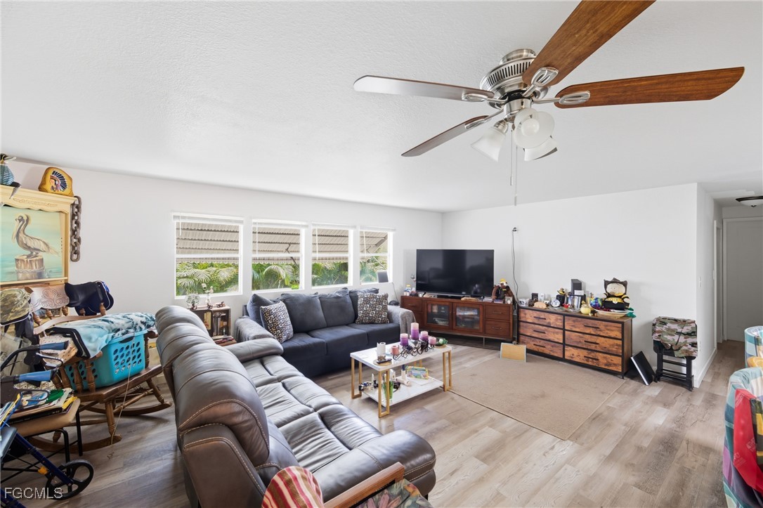 136 Lexington Avenue Fort Myers, FL 33908 - Photo 9 of 31 a living room with furniture and a flat screen tv