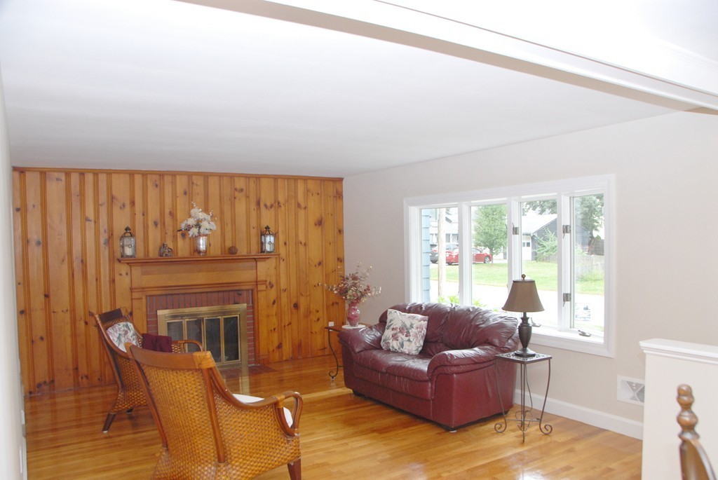 17 Margaret Road Hamilton, MA 01982 - Photo 13 of 24 a living room with furniture and a fireplace