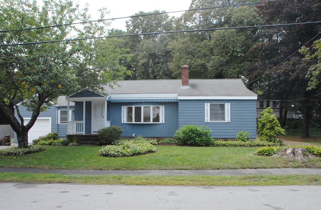 17 Margaret Road Hamilton, MA 01982 - Photo 3 of 24 a front view of a house with a garden