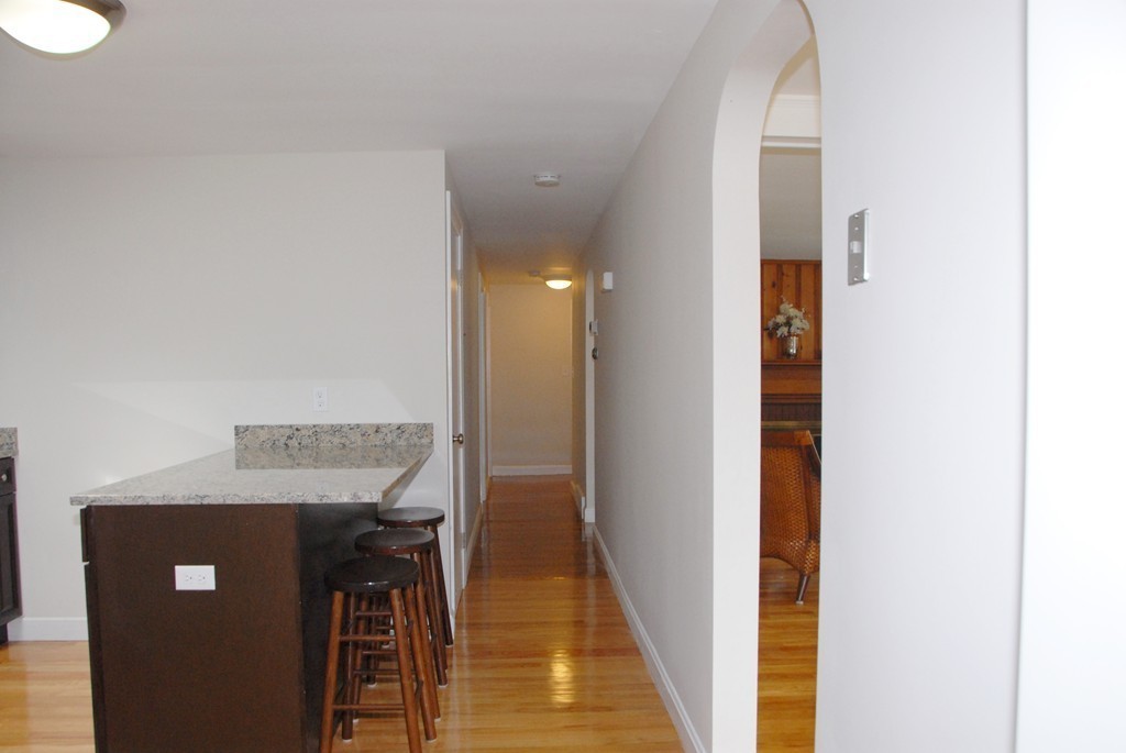 17 Margaret Road Hamilton, MA 01982 - Photo 8 of 24 a view of a hallway with wooden floor