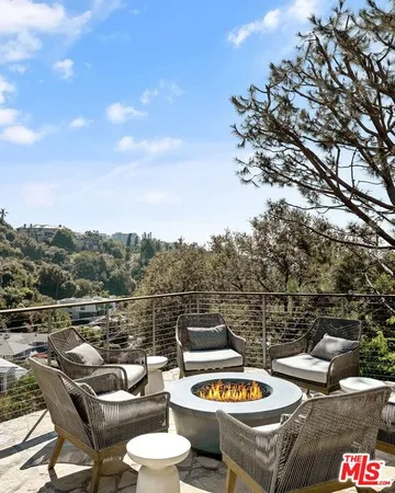 a view of a terrace with furniture and stove
