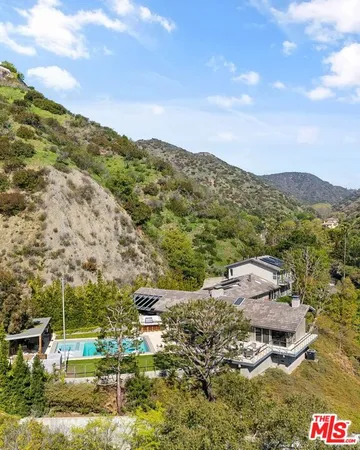 a view of a town with mountains in the background