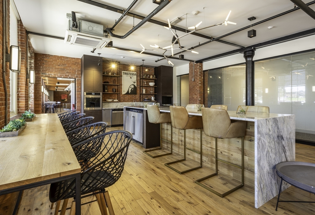 165 Thorndike Street, Unit 403 Lowell, MA 01852 - Photo 6 of 10 a view of a dining room with furniture window and outside view