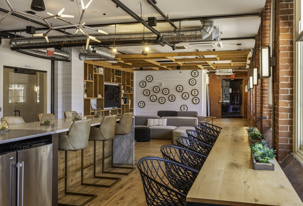 165 Thorndike Street, Unit 403 Lowell, MA 01852 - Photo 9 of 10 a outdoor space with patio furniture