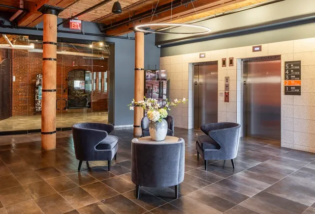 a view of a entryway door and dining room