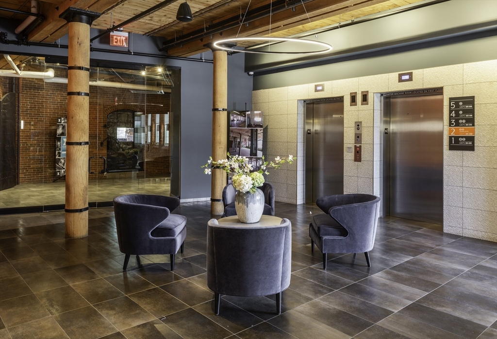 165 Thorndike Street, Unit 403 Lowell, MA 01852 - Photo 10 of 10 a view of a entryway door and dining room