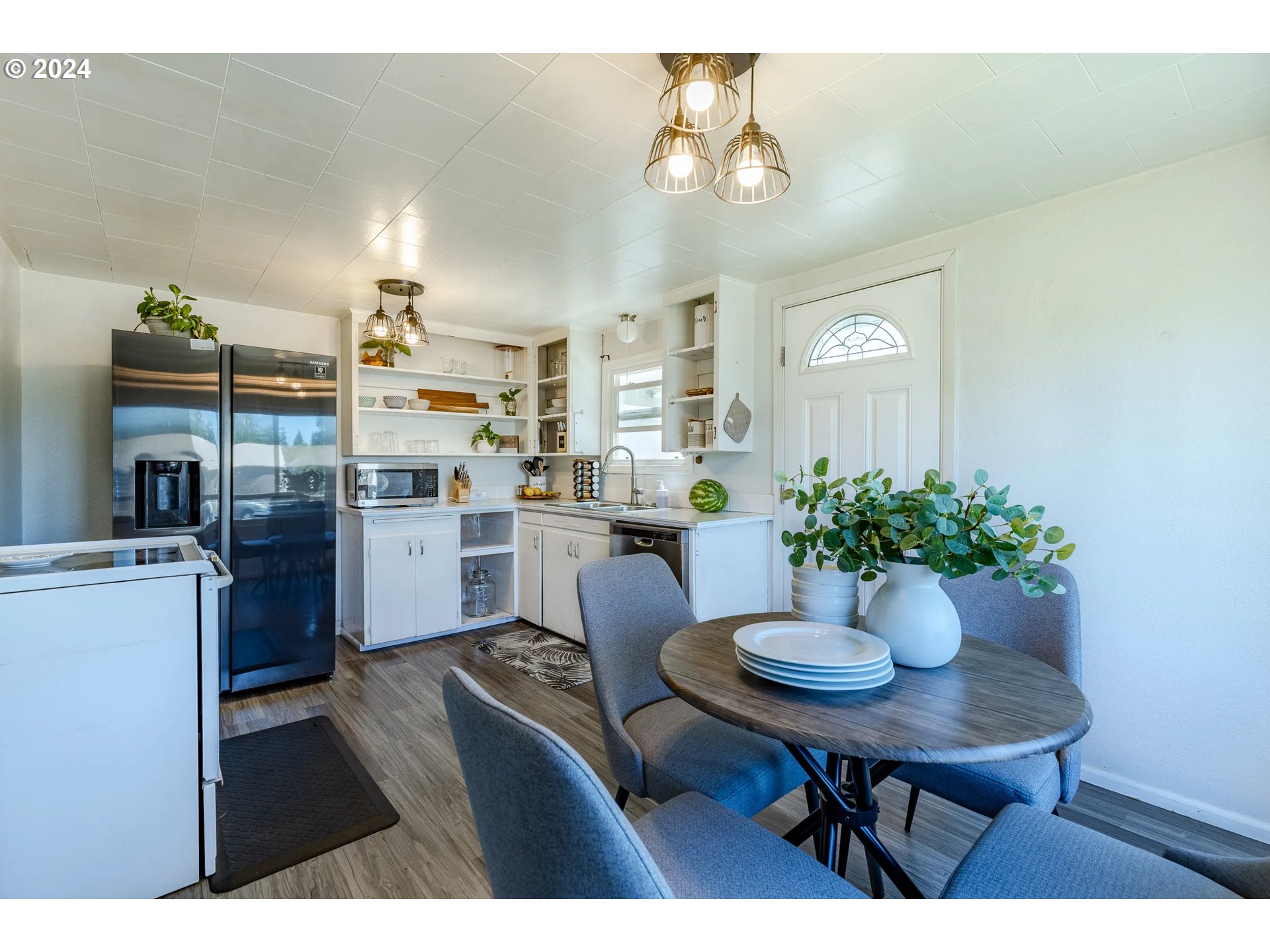 447 19th Street Springfield, OR 97477 - Photo 9 of 23 a kitchen with a table and chairs in it
