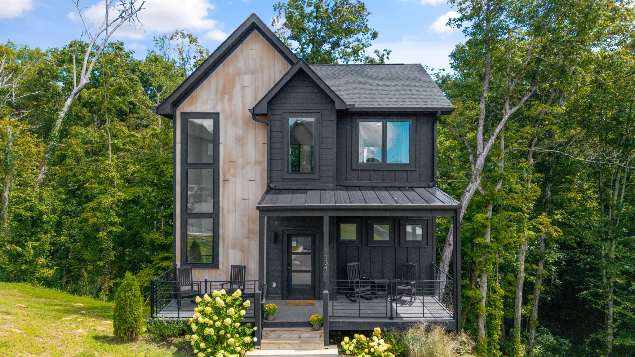 1134 Reedmont Way Sevierville, TN 37876 - Photo 1 of 42 a front view of a house with garden