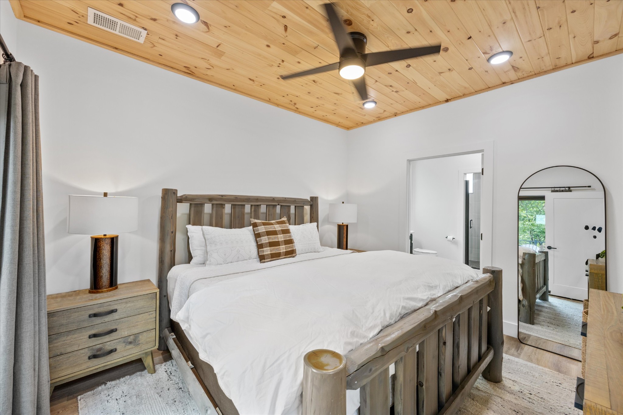 1134 Reedmont Way Sevierville, TN 37876 - Photo 15 of 42 a bedroom with a bed a chandelier and dresser