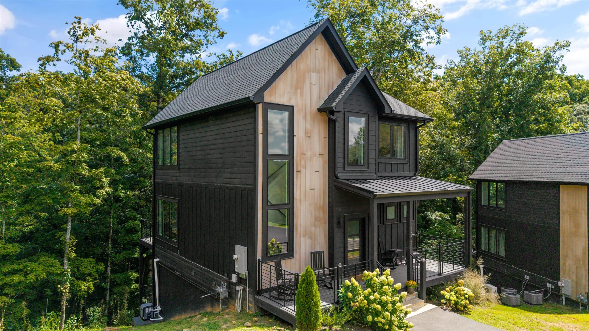 1134 Reedmont Way Sevierville, TN 37876 - Photo 2 of 42 a view of small house with yard and outdoor seating