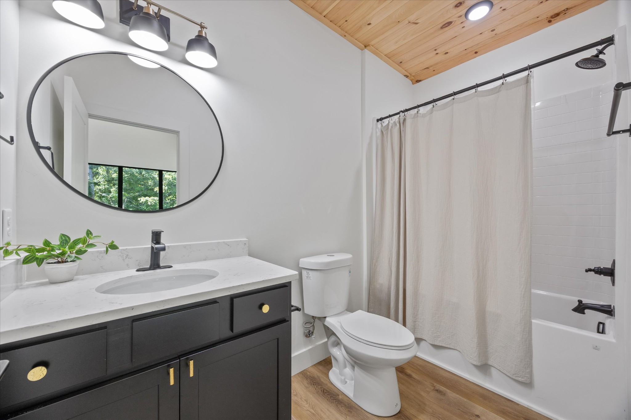 1134 Reedmont Way Sevierville, TN 37876 - Photo 29 of 42 a bathroom with a sink vanity mirror and toilet