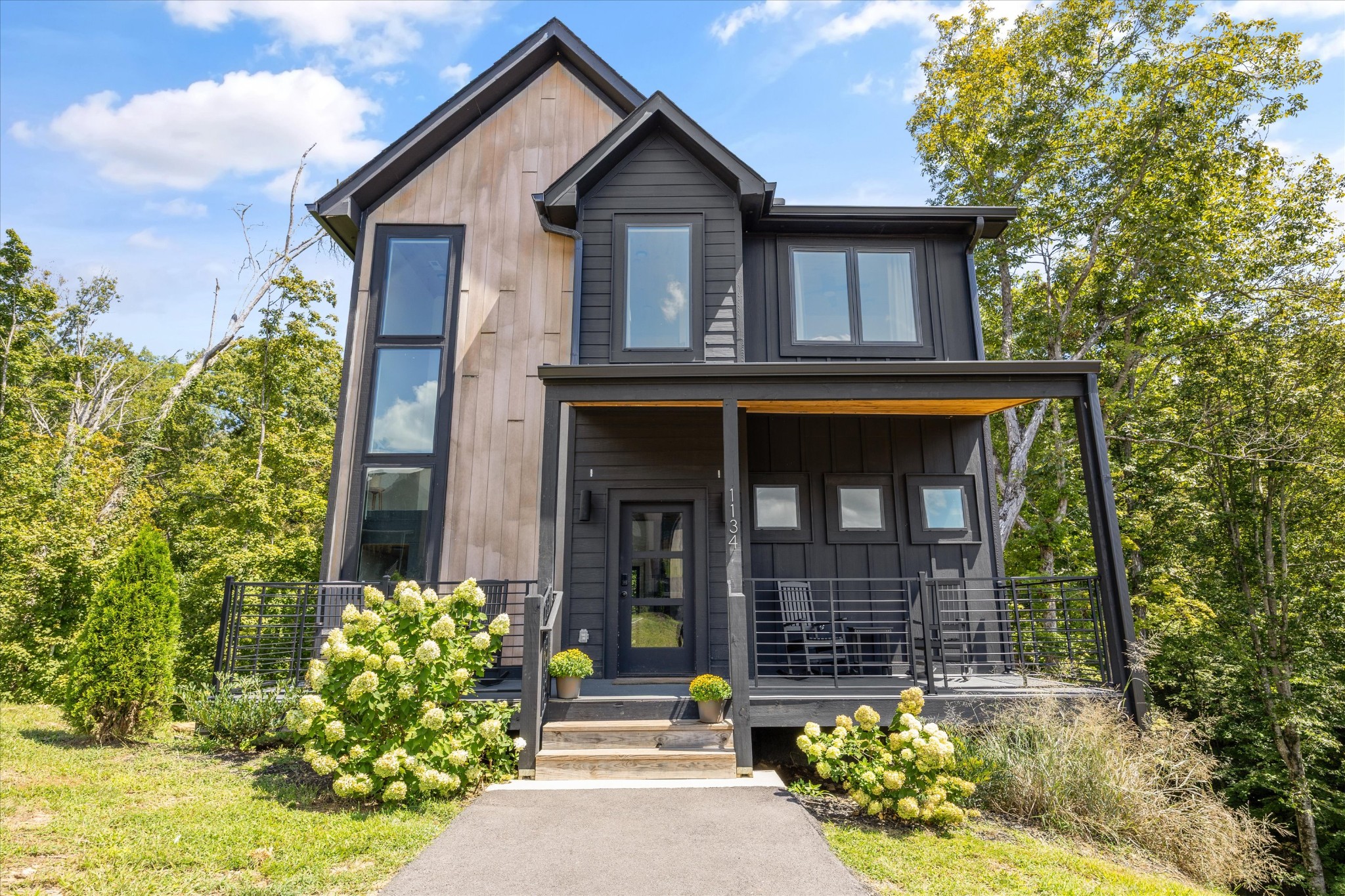 1134 Reedmont Way Sevierville, TN 37876 - Photo 3 of 42 a front view of a house with garden
