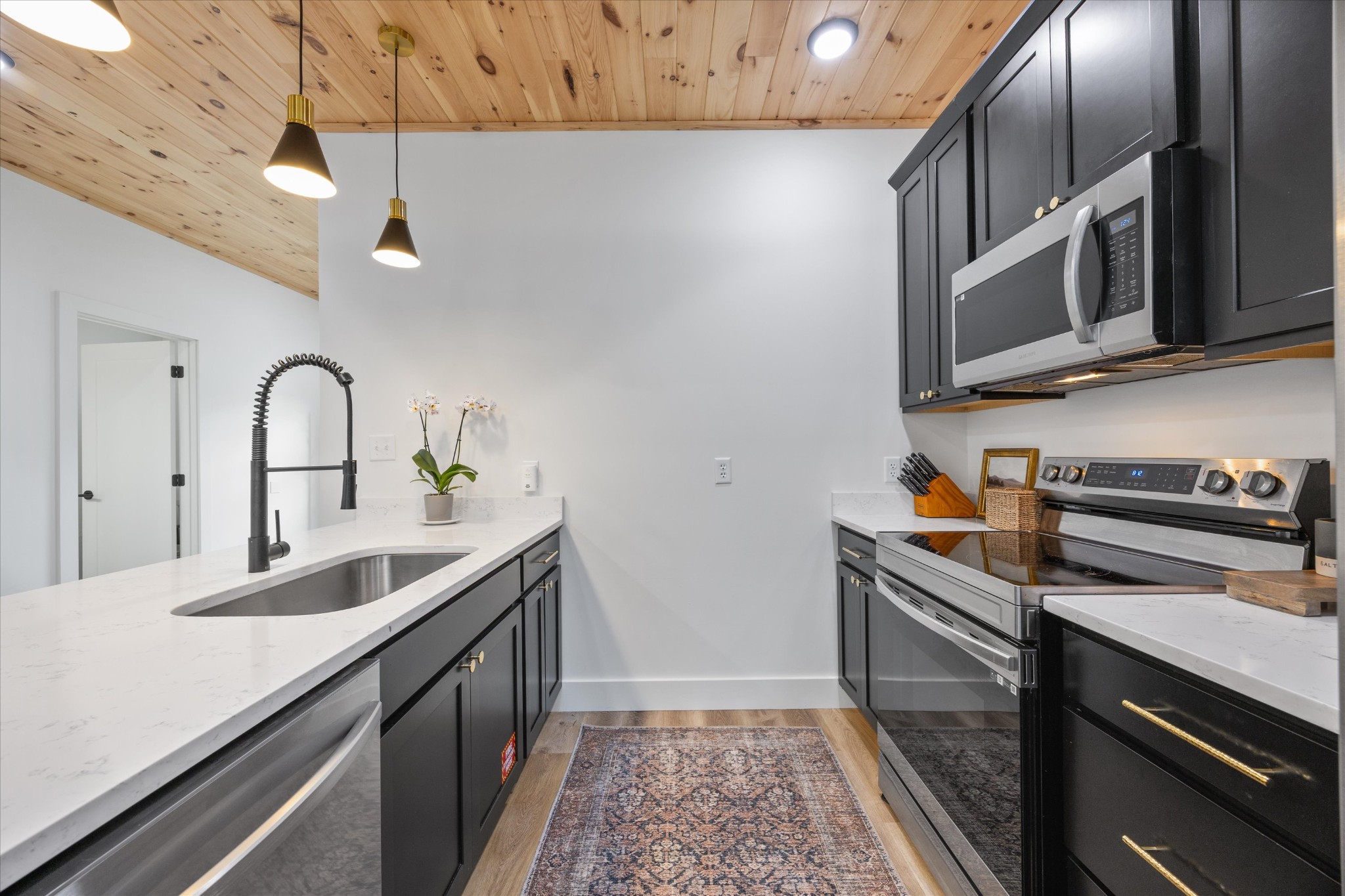 1134 Reedmont Way Sevierville, TN 37876 - Photo 8 of 42 a kitchen with stainless steel appliances granite countertop a sink and cabinets