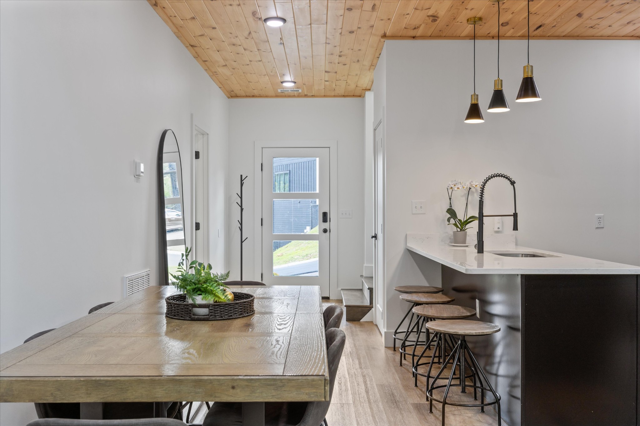 1134 Reedmont Way Sevierville, TN 37876 - Photo 10 of 42 a dining room with kitchen island a sink table and chairs