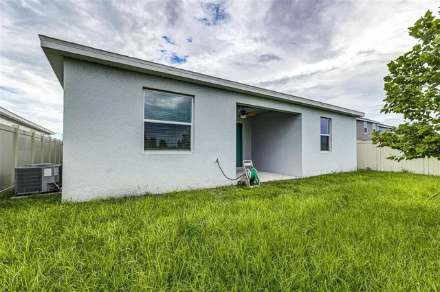 a backyard of a house with lots of green space