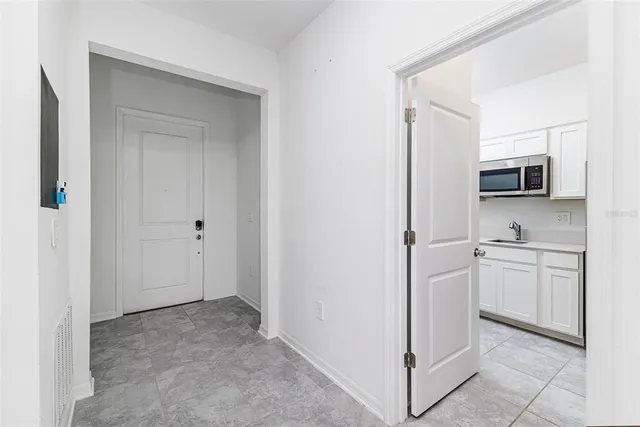 a view of a kitchen with appliances