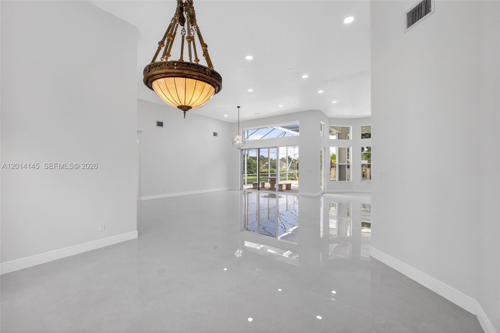 19558 Red Gum Trail Jupiter, FL 33458 - Photo 11 of 81 a very nice looking room with a dining table chairs