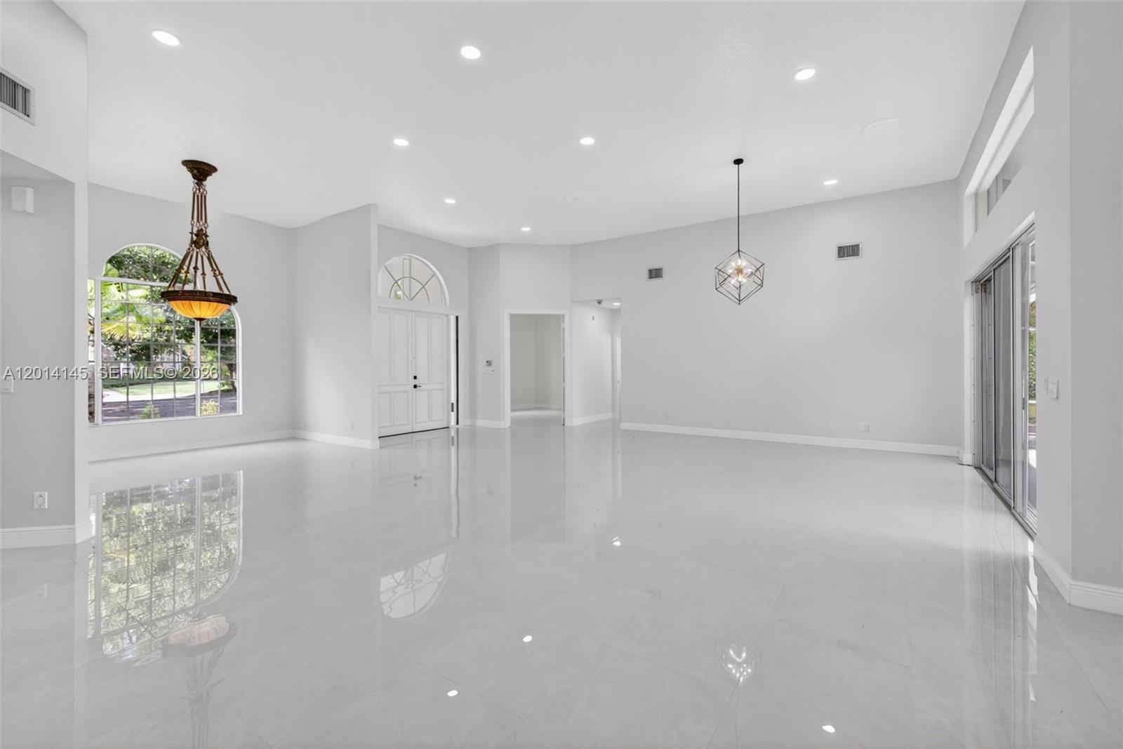 19558 Red Gum Trail Jupiter, FL 33458 - Photo 18 of 81 a view of an empty room with wooden floor