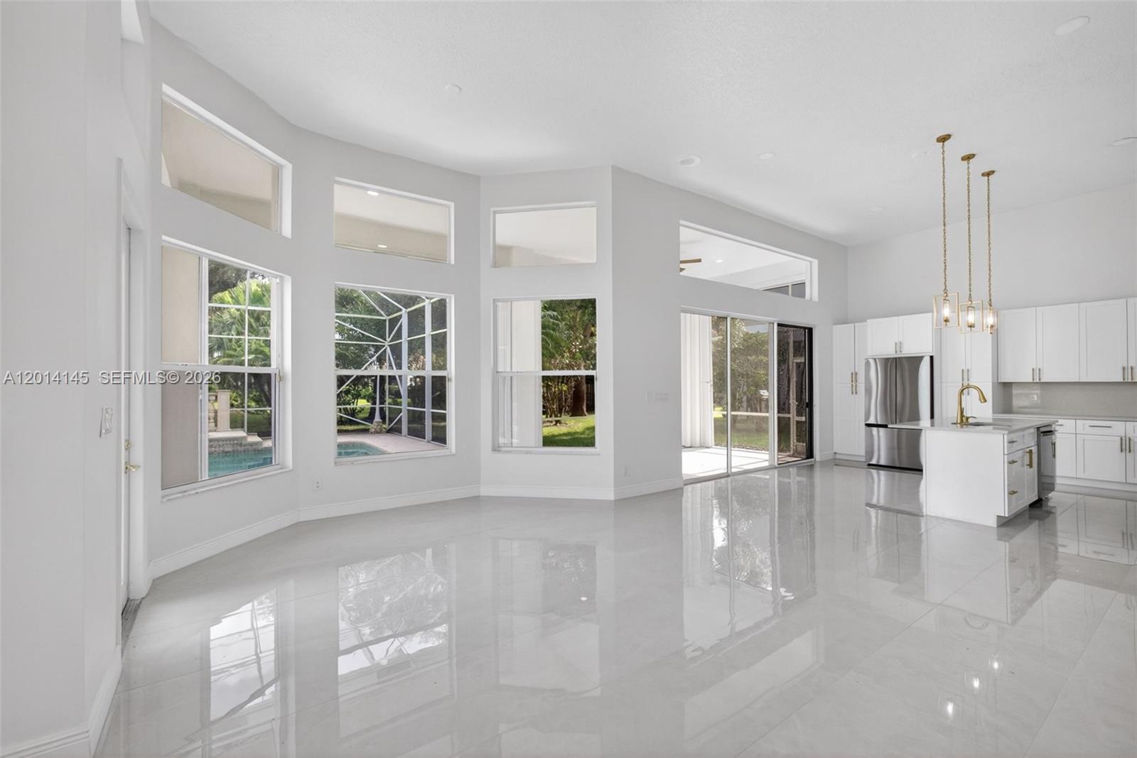 19558 Red Gum Trail Jupiter, FL 33458 - Photo 21 of 81 a view of an empty room with kitchen