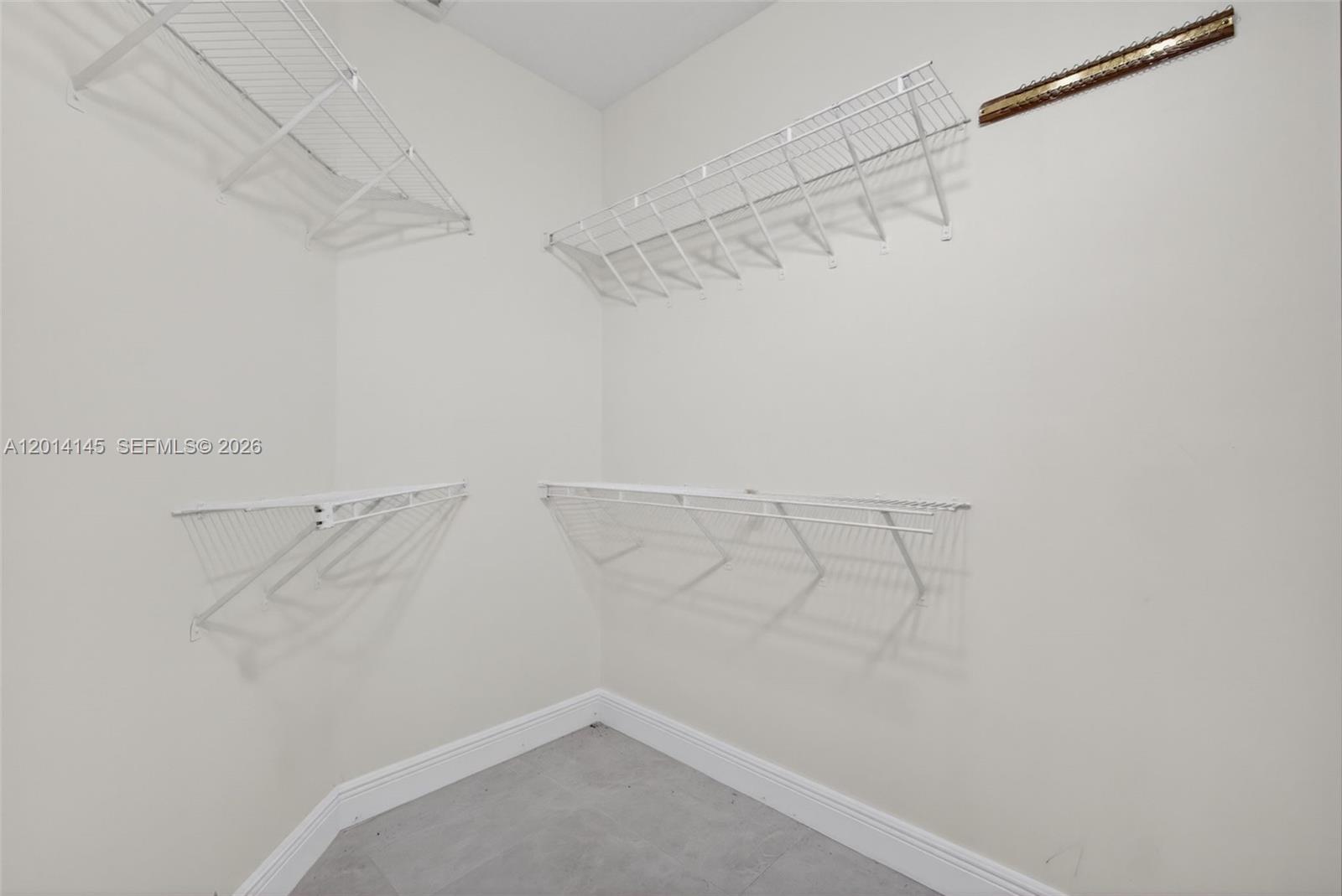 19558 Red Gum Trail Jupiter, FL 33458 - Photo 33 of 81 a view of a room with racks on the wall