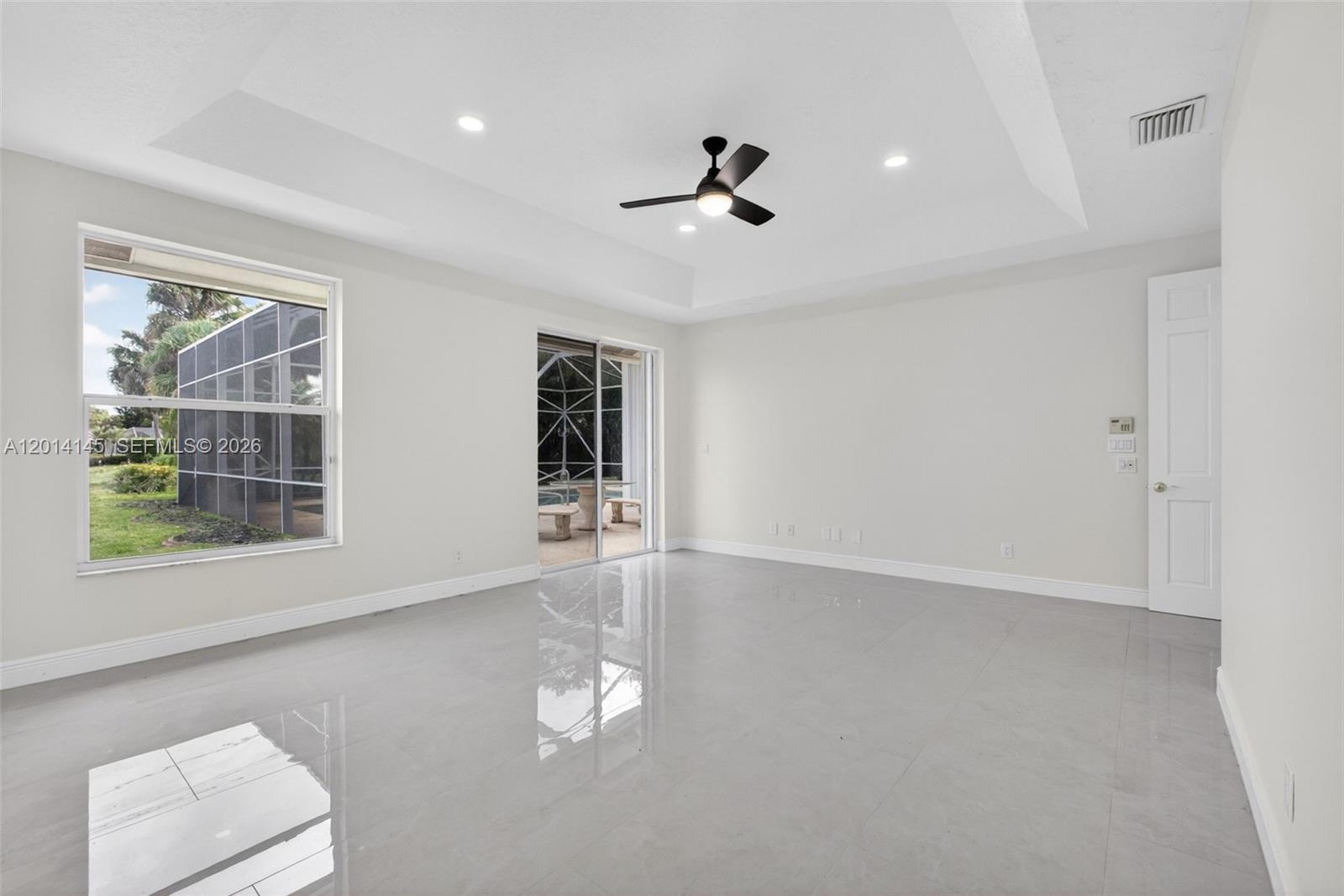 19558 Red Gum Trail Jupiter, FL 33458 - Photo 35 of 81 a view of empty room with windows