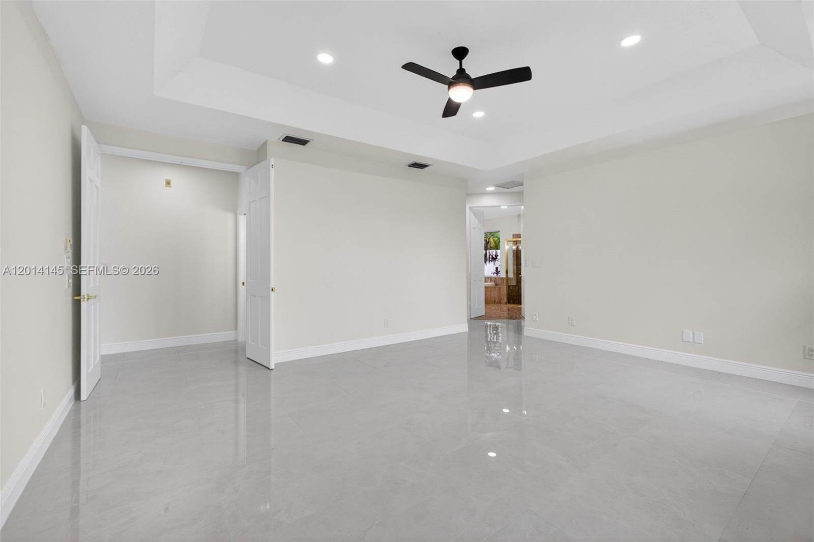 19558 Red Gum Trail Jupiter, FL 33458 - Photo 37 of 81 an empty room with closet and windows