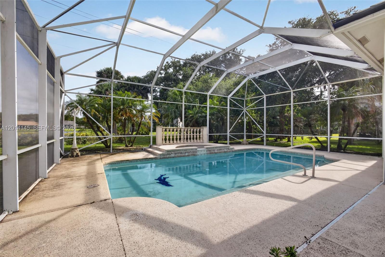 19558 Red Gum Trail Jupiter, FL 33458 - Photo 54 of 81 a view of a backyard with swimming pool and sitting area