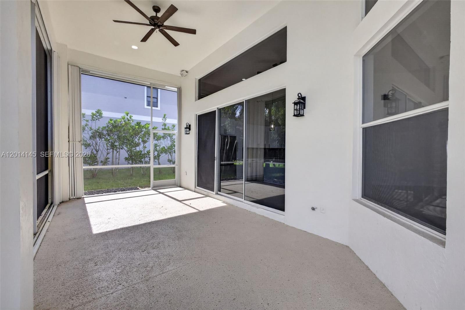 19558 Red Gum Trail Jupiter, FL 33458 - Photo 55 of 81 a view of an empty room with a window and a fireplace