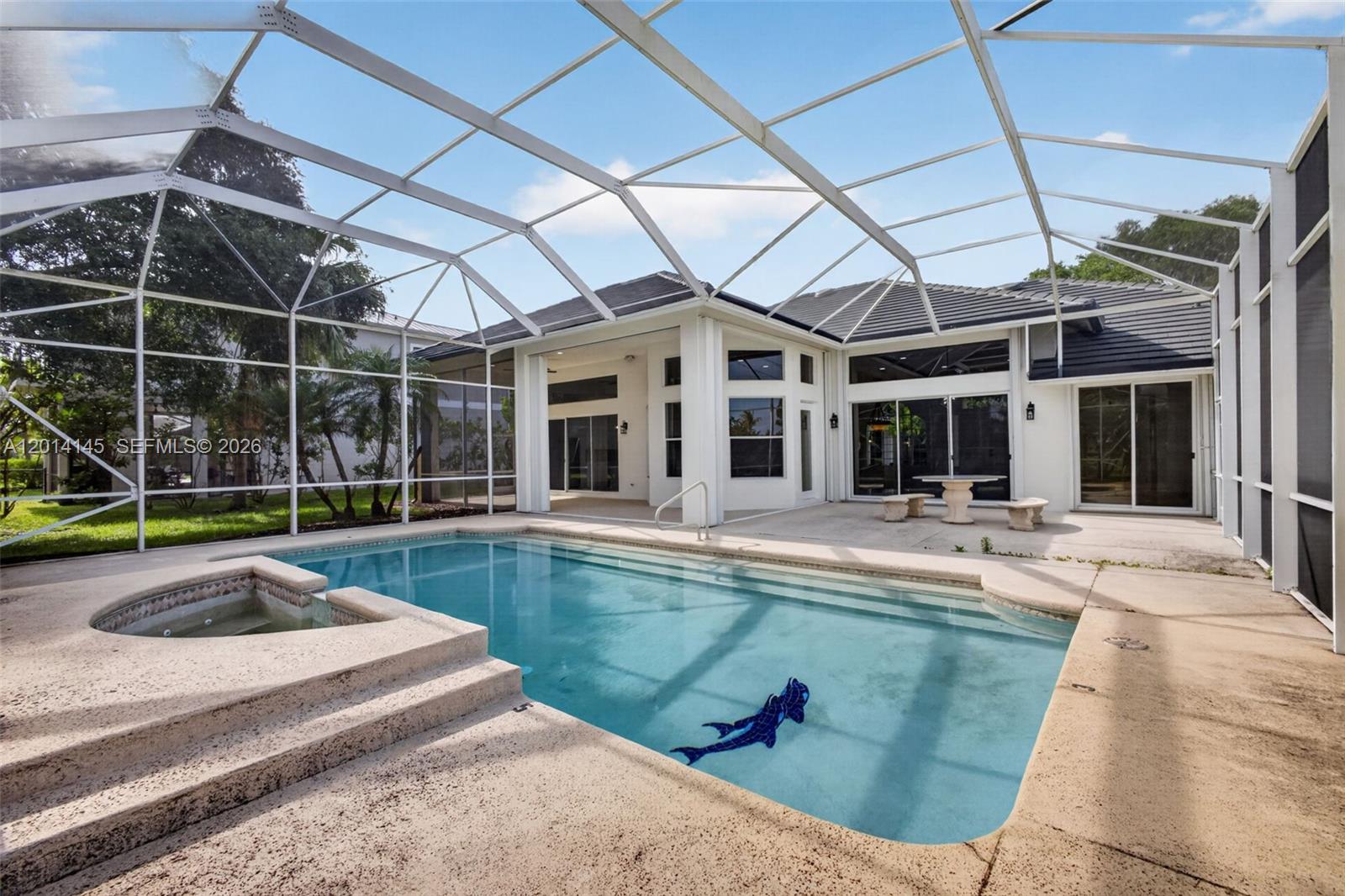 19558 Red Gum Trail Jupiter, FL 33458 - Photo 60 of 81 a view of a house with a swimming pool