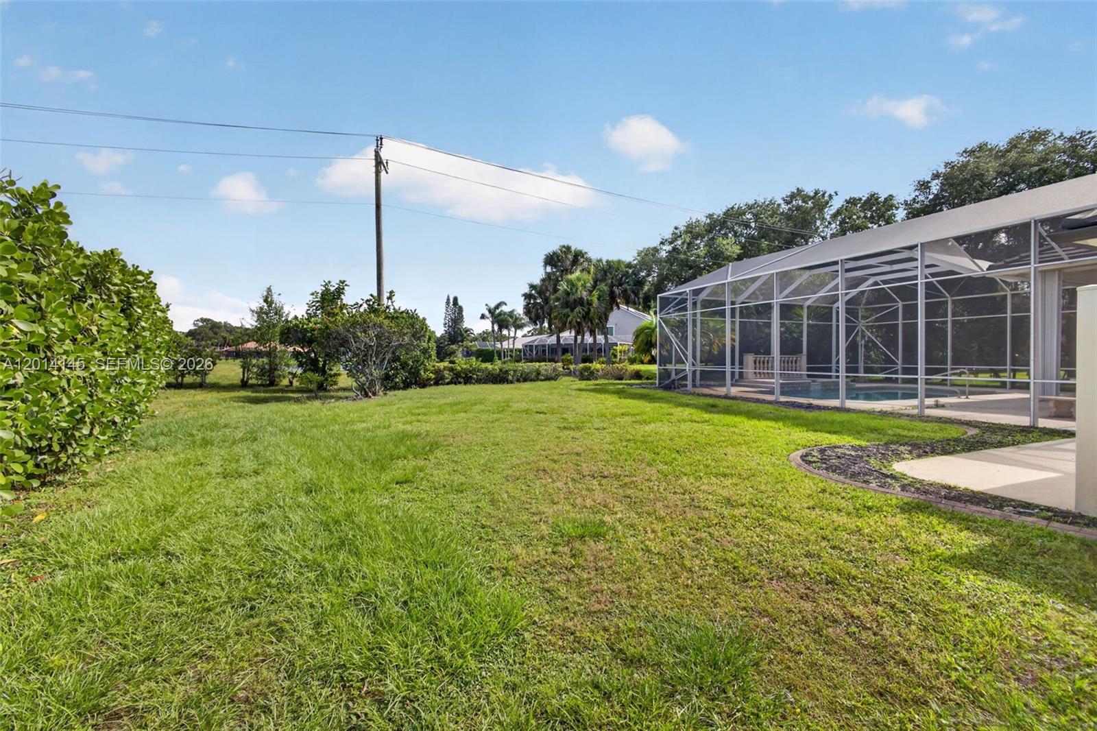 19558 Red Gum Trail Jupiter, FL 33458 - Photo 62 of 81 a view of a house with a swimming pool