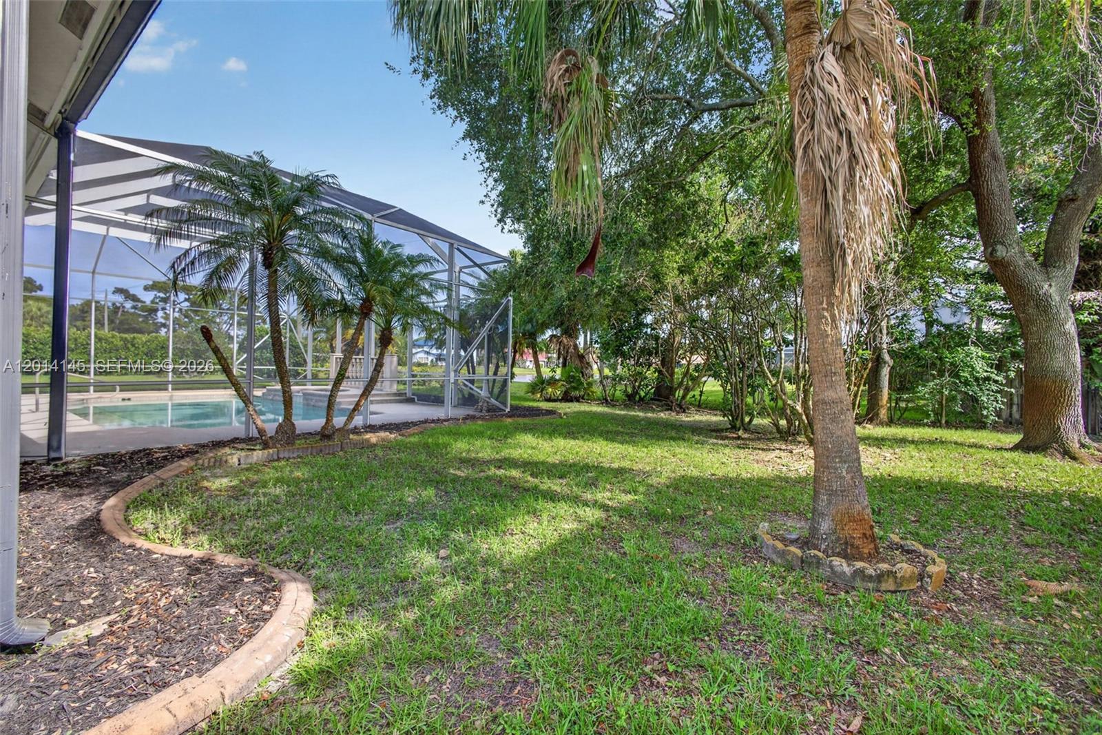 19558 Red Gum Trail Jupiter, FL 33458 - Photo 65 of 81 a view of a yard with a tree
