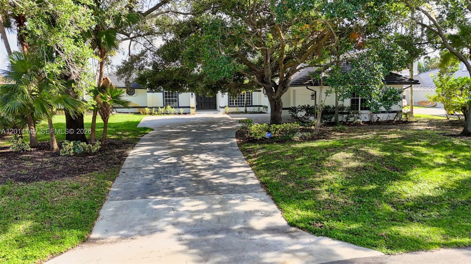 19558 Red Gum Trail Jupiter, FL 33458 - Photo 66 of 81 a view of a yard with plants and trees