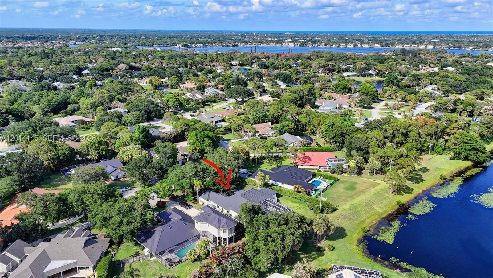 19558 Red Gum Trail Jupiter, FL 33458 - Photo 74 of 81 an aerial view of a house with a yard