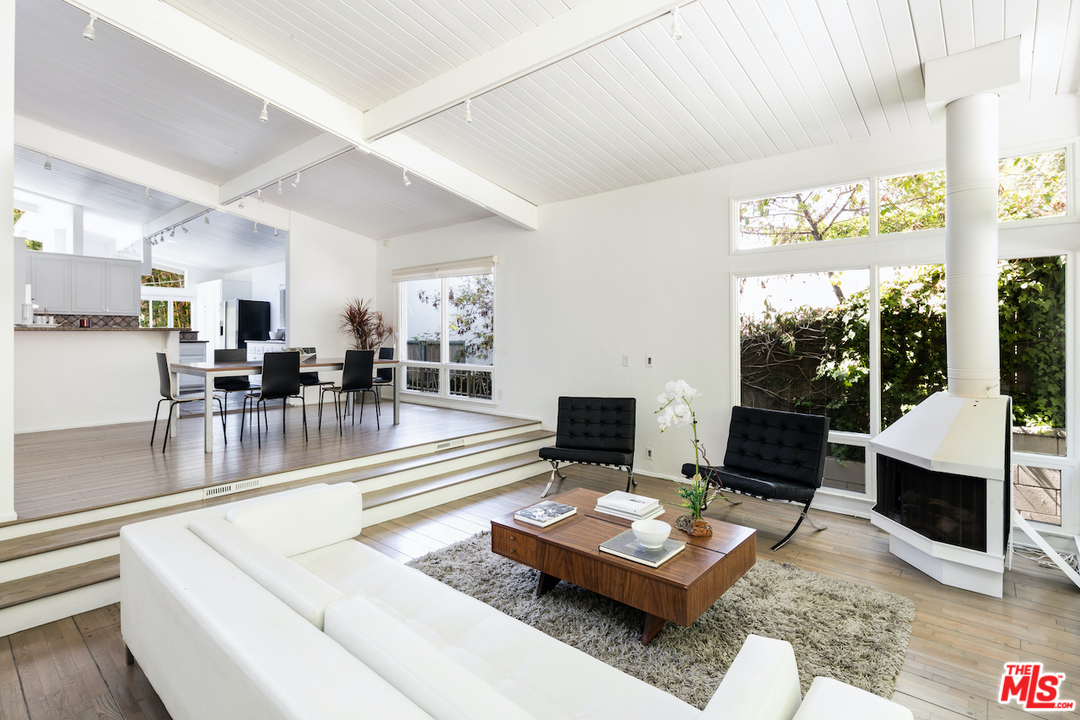 348 Sycamore Road Santa Monica, CA 90402 - Photo 4 of 12 a living room with furniture and a fireplace