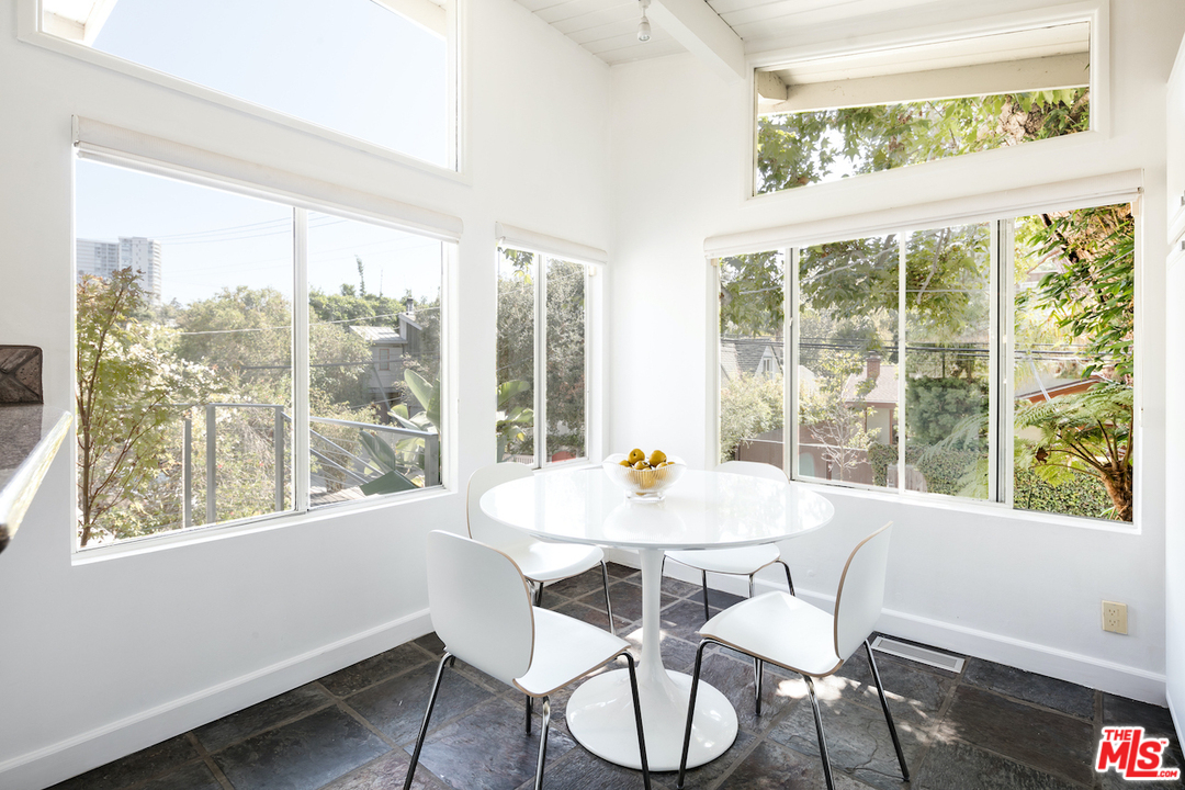 348 Sycamore Road Santa Monica, CA 90402 - Photo 6 of 12 a view of a dining room with furniture window and wooden floor