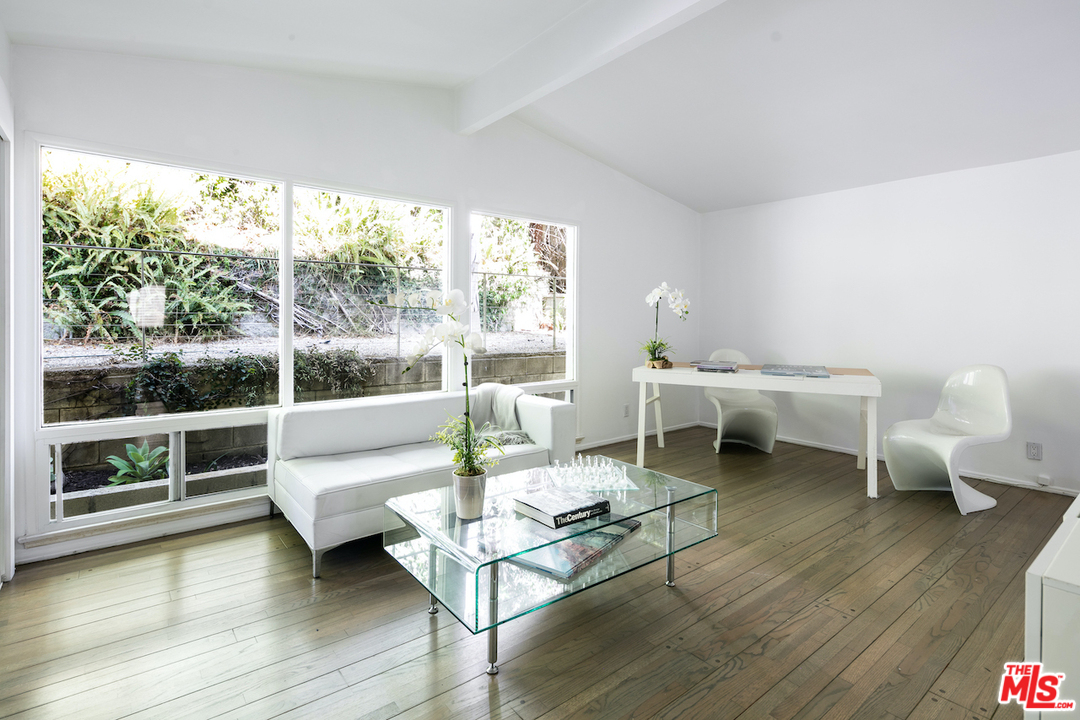 348 Sycamore Road Santa Monica, CA 90402 - Photo 7 of 12 a living room with furniture and a wooden floor