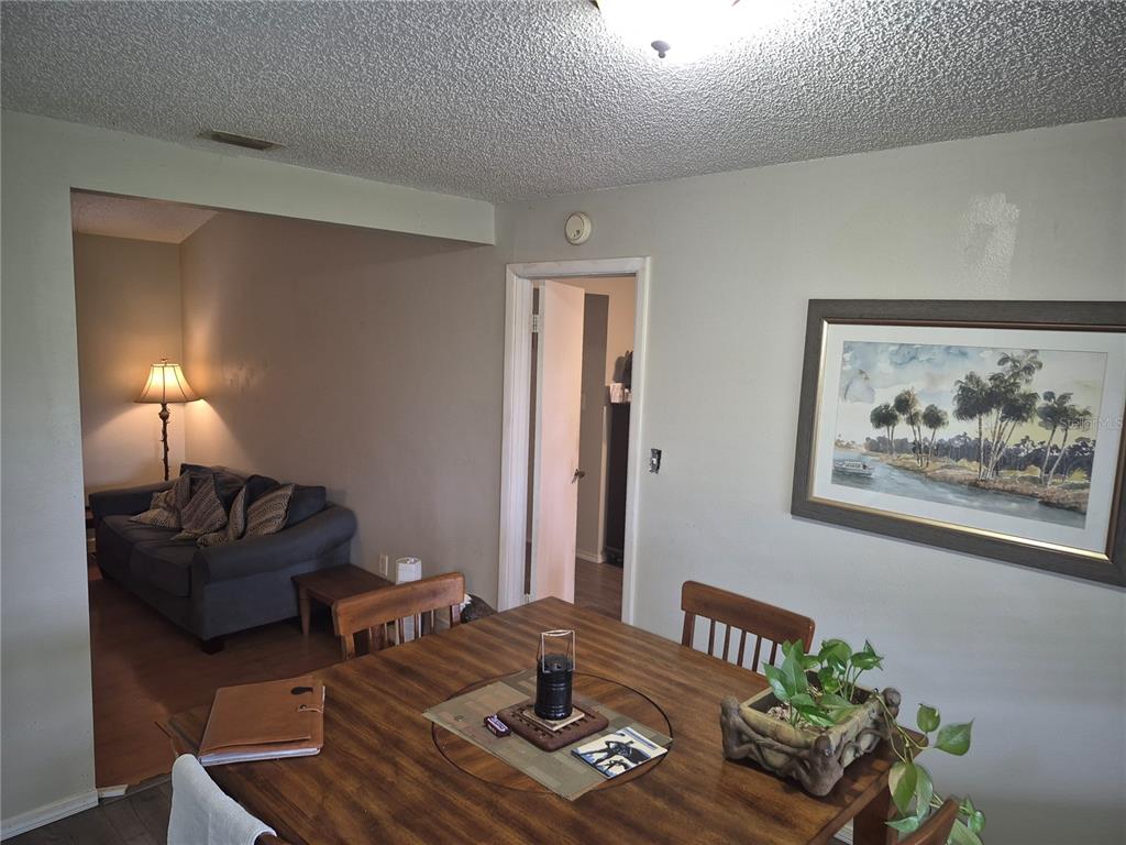 13710 Whitby Road Hudson, FL 34667 - Photo 5 of 21 a living room with furniture and wooden floor